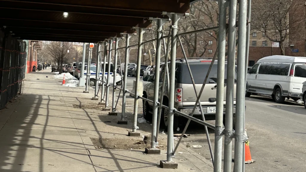 Long Island scaffolding contractors installing sidewalk shed for building exterior work