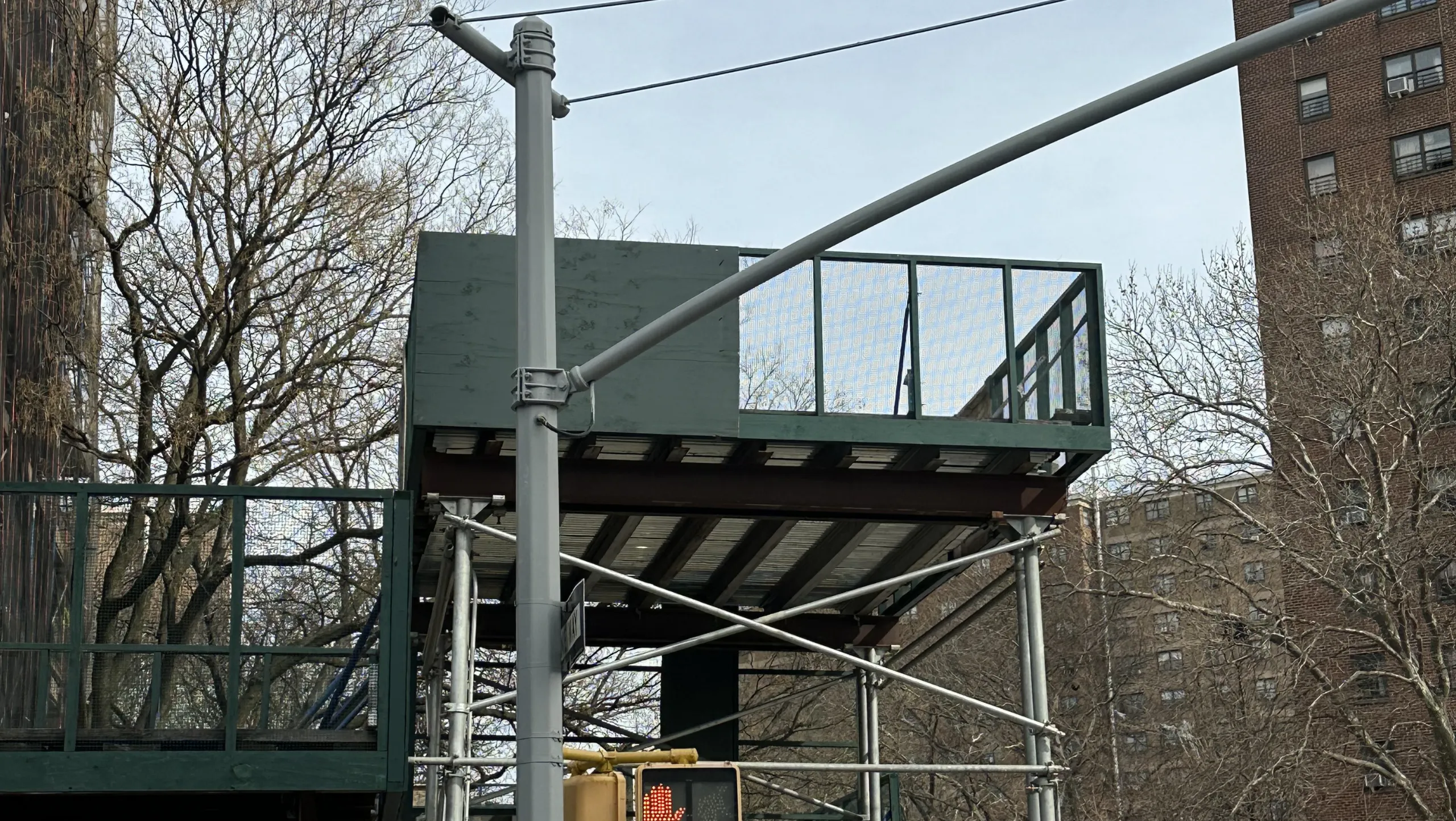 Workers on suspended scaffolding platform